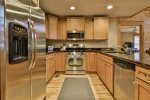 Open kitchen with stainless steel appliances
